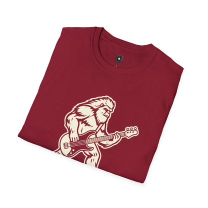 Yeti silhouette with Bass guitar in a cream-colored graphic.