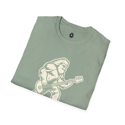 Yeti silhouette with Bass guitar in a cream-colored graphic.
